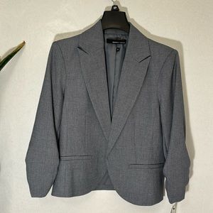 Sharp medium grey blazer for professional woman. Size 8 petite